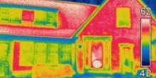 An infrared image of the exterior of a house showing heat loss.