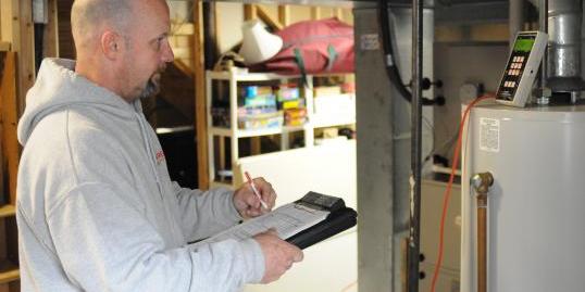 A man doing a safety check for Assured Energy Solutions, LLC. 